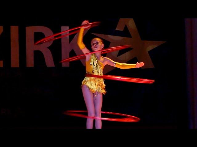 Circus acrobatic performance with hoops at the Talent Show ZIRKA! Dance with hoops