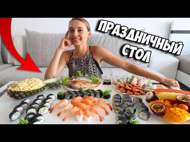 Holiday dishes in Thailand, sushi rolls, fish in salt, spring rolls