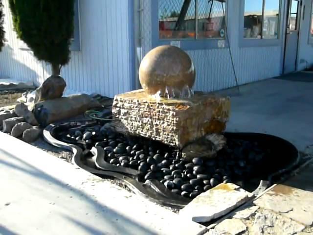 StoneBella floating sphere water fountain. Solid ball spins on water