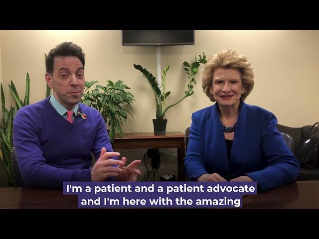 Peter Morley speaks with Senator Stabenow.