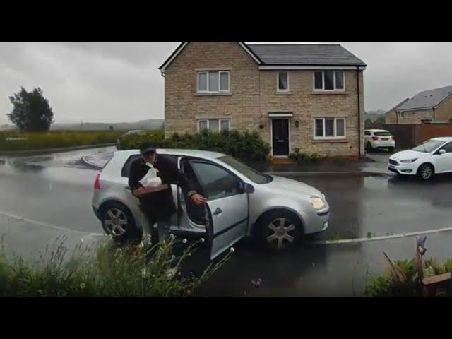 Boy stops delivery driver's car from rolling away on a rainy day || WooGlobe