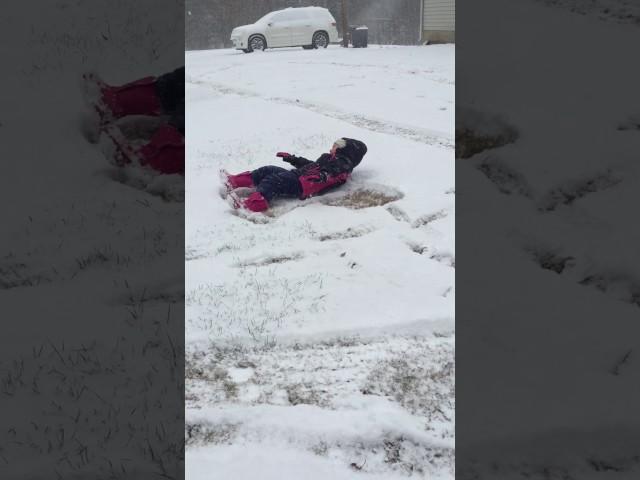 Gracie makes a Snow Angel