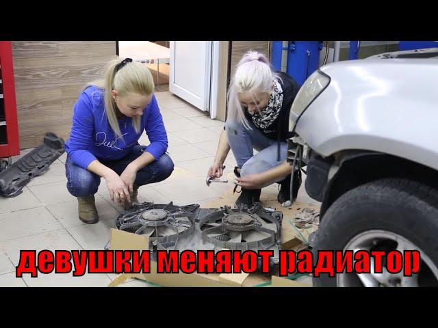 beautiful girls repairing a car