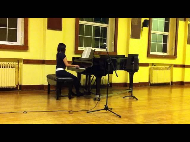 Cathy Ng  playing the piano in a sch concert