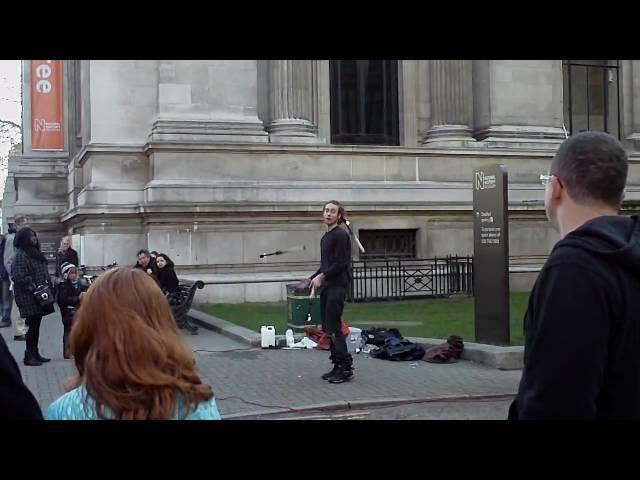 Fire Juggler outside the Museum of Natural History, London, England