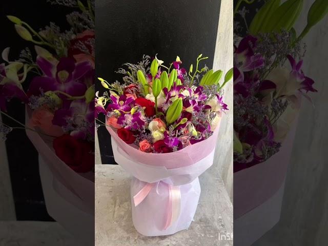 purple orchid,  lily bouquet @ creative florist