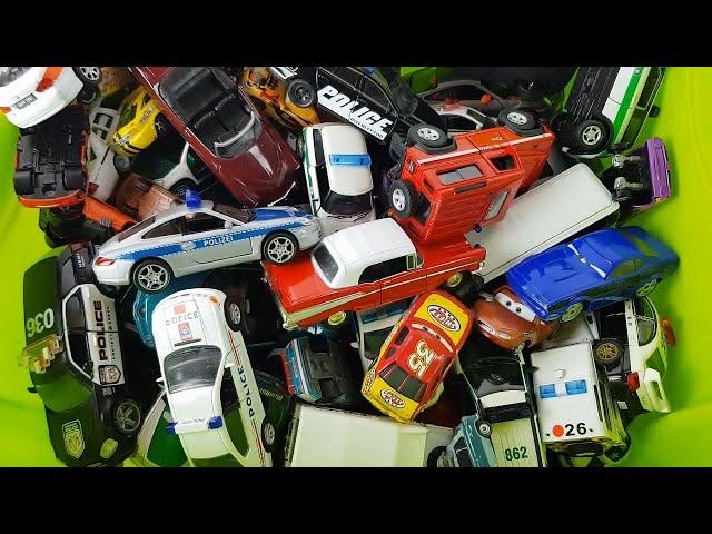 Box full of various miniature cars