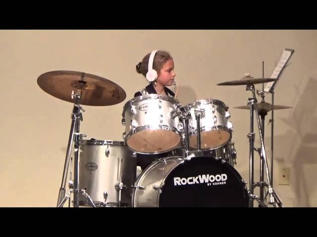 Sydney plays drums