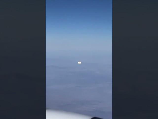 Airliner Passenger Films Strange UFO Cluster Flying Alongside Plane