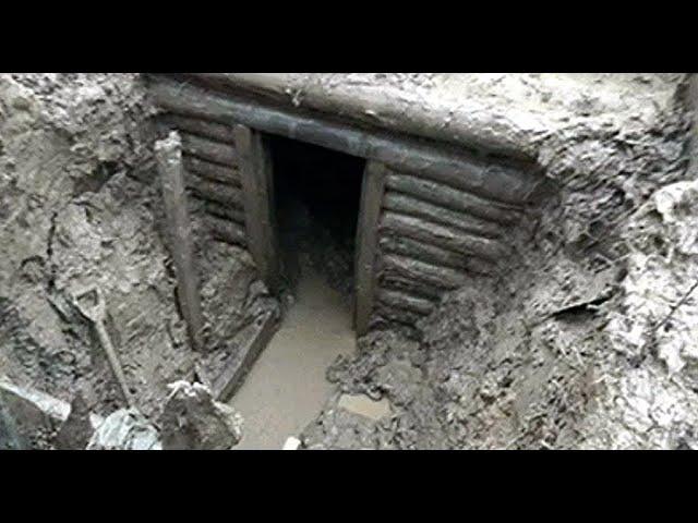 EXCAVATION OF A GERMAN DUGOUT WITH WEAPONS AND AMMUNITION