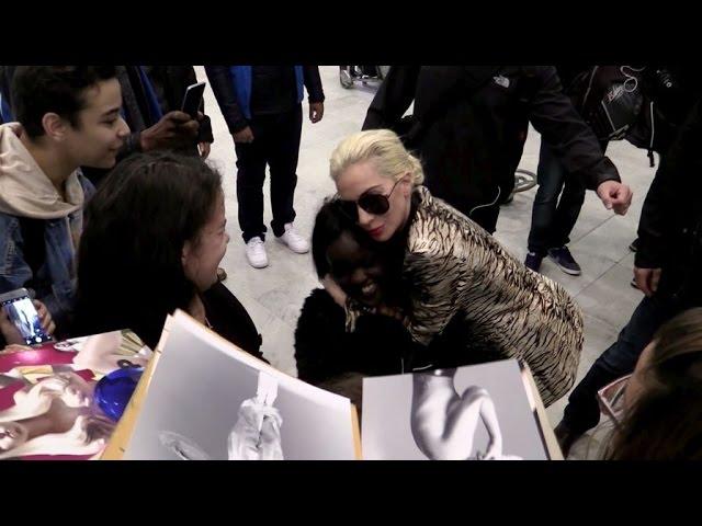 Lady Gaga always so nice to her little Monsters as she arrives in Paris