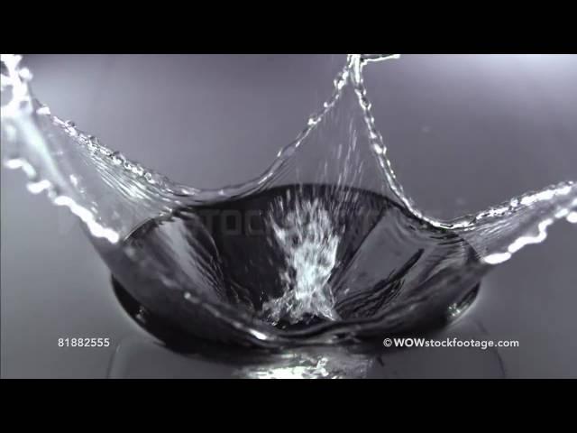 Clear glass cube falling into water, Slow Motion