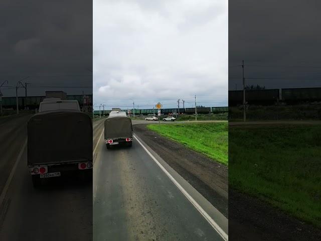 Russian Railroad Crossing. Freight train crossing Trans-Siberian railway. Tulushka