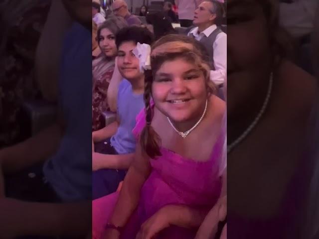 Me and my family at a concert taking a video