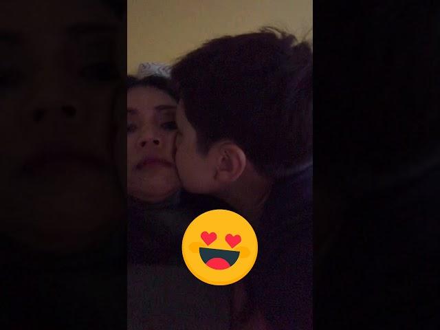 Son kiss mom on the lip