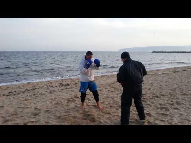 Stoyan Koprivlenski pads on the beach by Krasimir Dimov