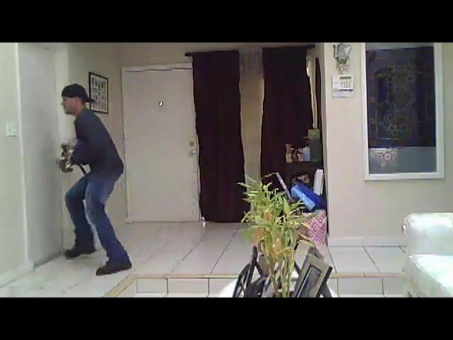 Surveillance video captures burglar inside Cooper City home