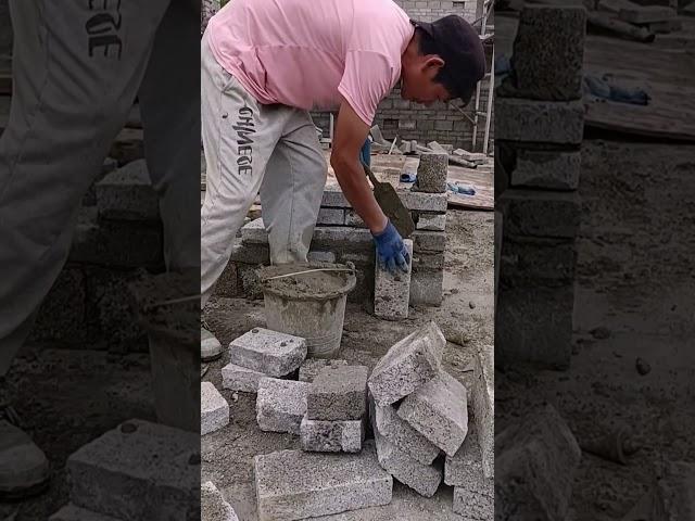 Grey brick partition wall installation