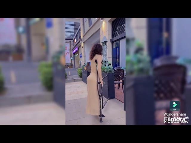 Beautiful woman with polio walks on crutches #disabled #polio