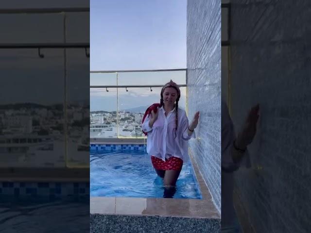 Wet red dress, white shirt, jeans jacket, nylon and high heels.