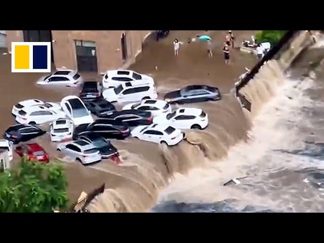 Vehicles washed away by floods as heavy downpours hit China