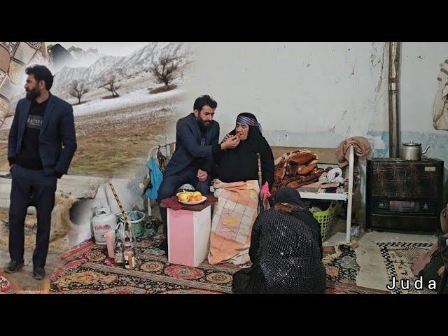 Engineer Babazadeh helping the elderly woman and Mrs. Juda taking care of her