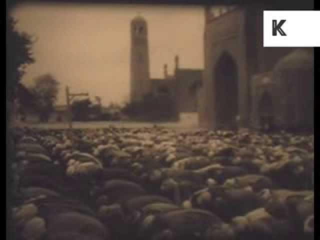 Archive footage of Afghanistan, street scenes, women, men praying