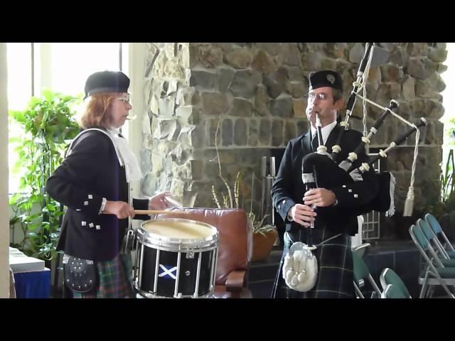 The Black Bear on Bagpipes and Drum