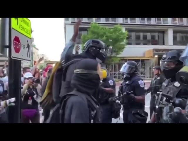 7ft tall anonymous Spec ops guy at DC protest bullying and intimidating police