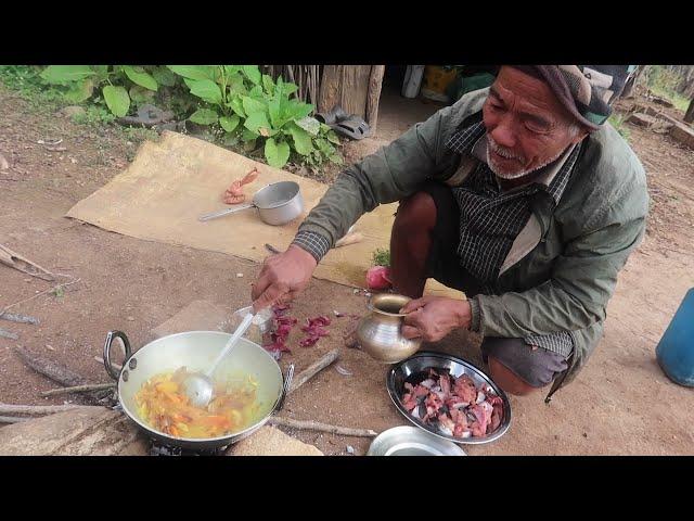 the old man cooking and eating