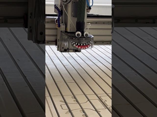 CNC machine with googly eye and monster teeth upgrade. It munches  carbon and metal even better!