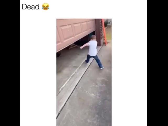 Kid hits head on the garage funny video 