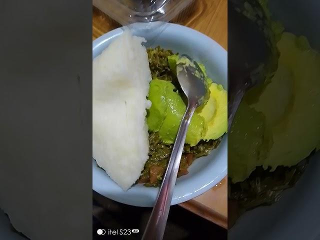 Eating ugali, sukuma wiki,and avocado, MercyNguku The World Traveller 