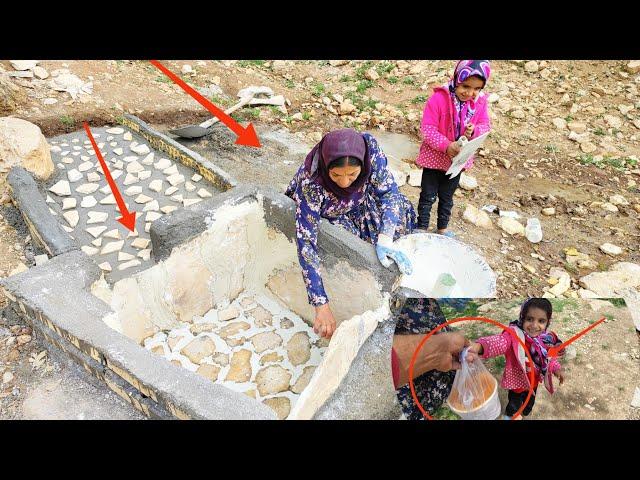 Water and life.  Completion of water pond project by a mother and orphan girl,