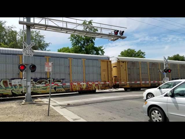 BNSF 6746 Manifest Northbound With Slow Order and Sacramento Light Rail, W Street, Sacramento CA