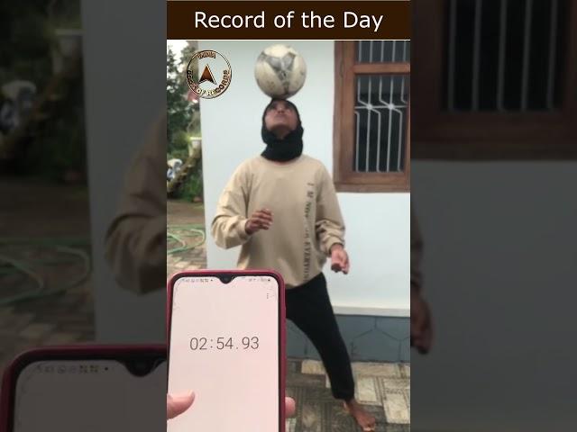 Football balanced on forehead by a teen for the longest duration while standing