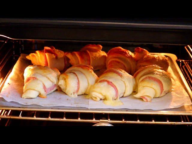 Croissant made from puff dough with sausage and cheese