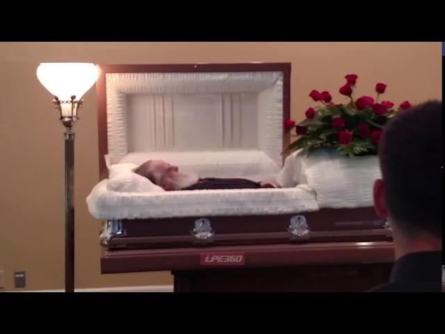 Dead guy moving inside coffin