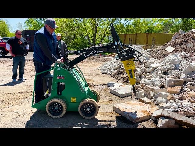 The Sherpa 100ECO with a Hydraulic Hammer Attachment Breaking Concrete