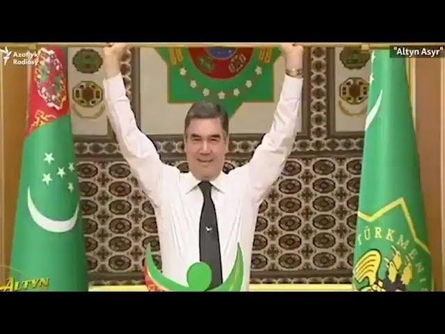 Turkmenistan's president lifts golden weight bar in front of his applauding cabinet