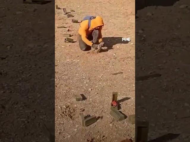 Young Syrian removes mines on the outskirts of the city of al-Bab.