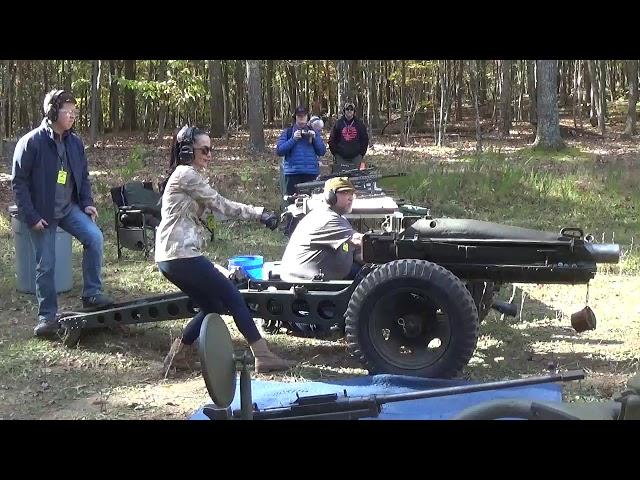 Firing 75mm pack Howitzer