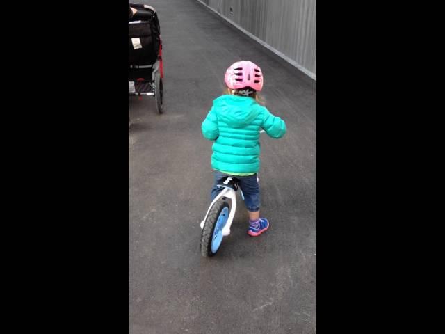 Maddie gliding on her balance bike