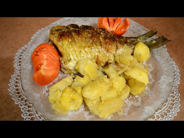 Carp baked in the oven with potatoes. Fast dinner.