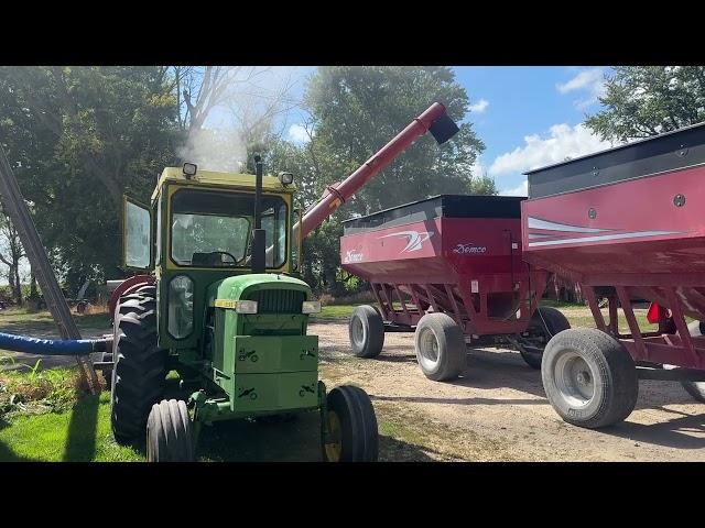 John Deere 4020 on a grain vac