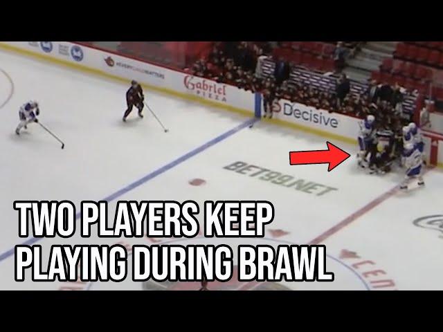 Hockey players go one on one while their teammates fight, a breakdown