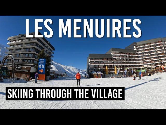 Skiing through Les Menuires village in Les 3 Vallees