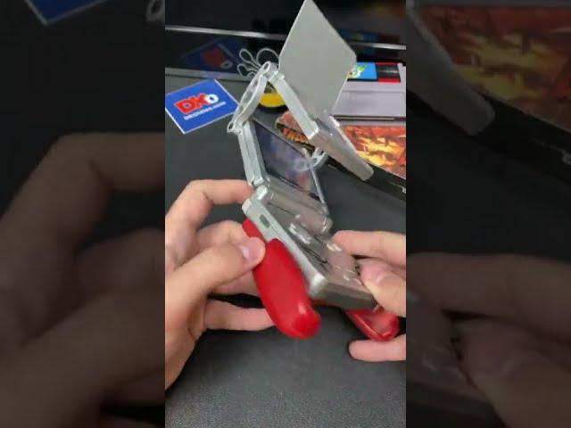 Grip and magnifying glass for the Game Boy Advance SP