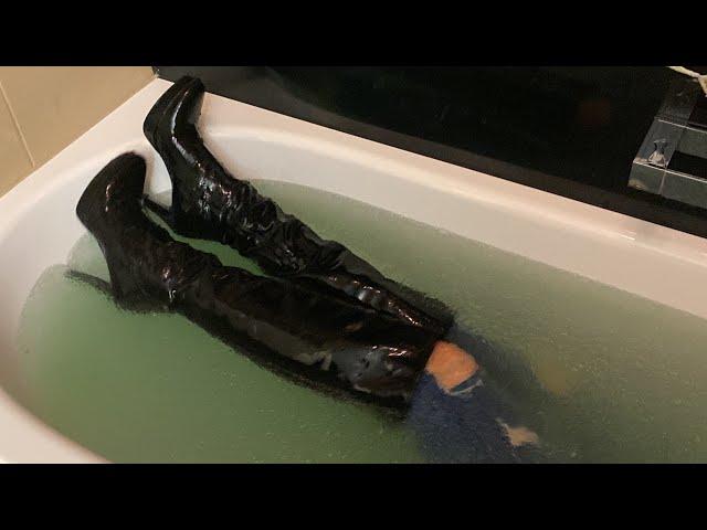 Girl in slime bath with ripped jeans shirt and high heel leather boots squelchy sounds squishy boots