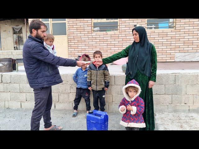 Buying fuel by Hossein from a village woman to heat the hut and children in the cold winter 